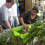 Groce helps student mix soil