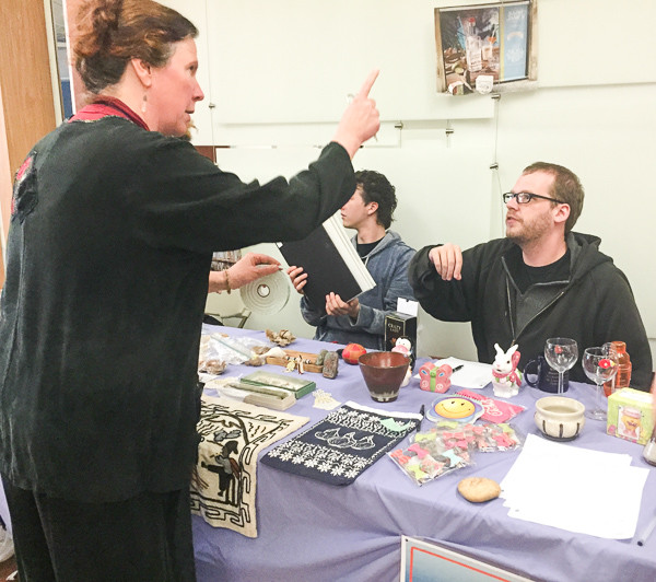 Elizabeth Thoburn gives instructions to Arts Club fundraiser volunteer