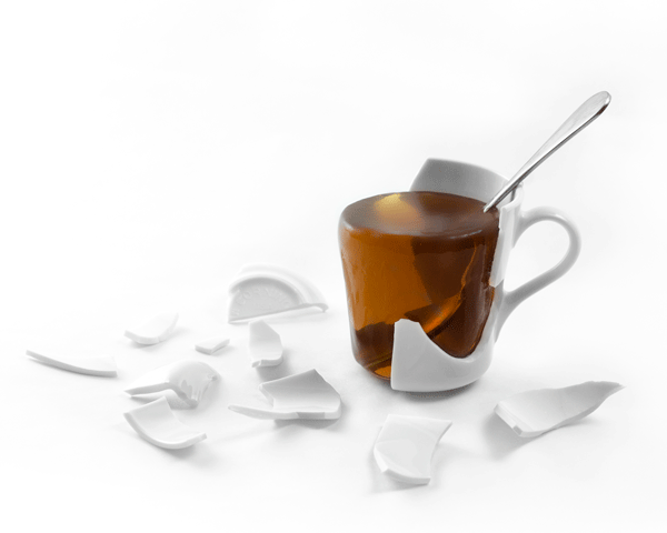 broken coffee mug with solid coffee