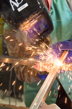 A.D. Quinn welding a piece