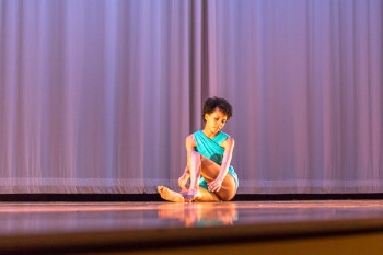 dancer sitting on stage
