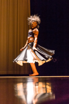 male dancer in skirt dancing on stage