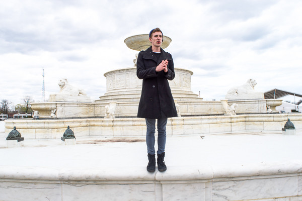 Rob Woodcox standing by fountain