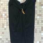 knot tied on backside of T-shirt