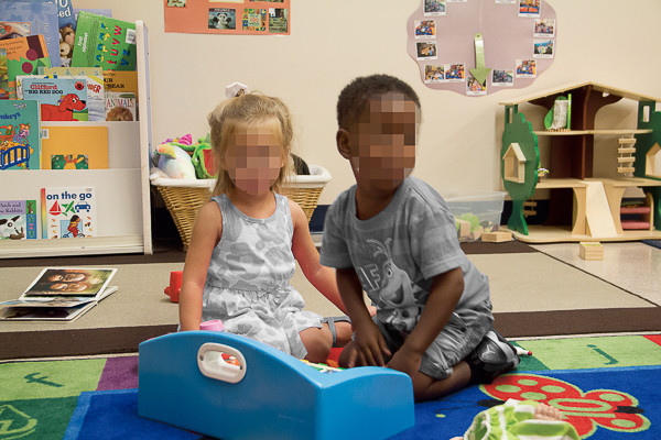 a boy and girl playing