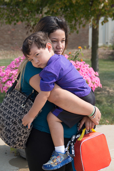 Valarie Cabrera holds her child in her arms