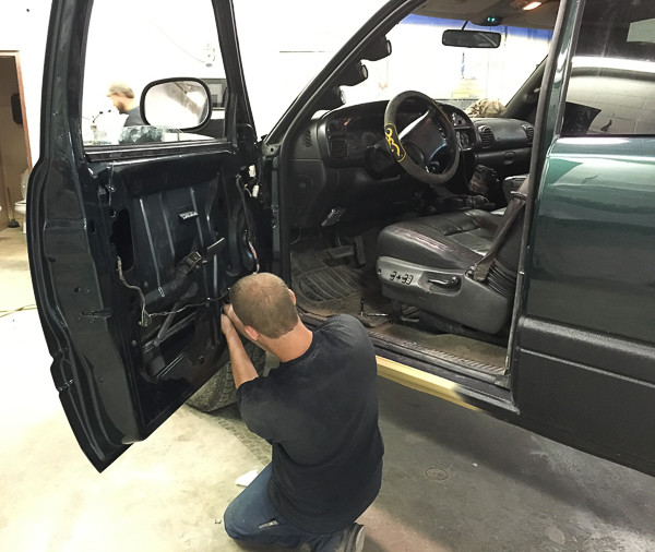 WCC alumnus working on an automobile
