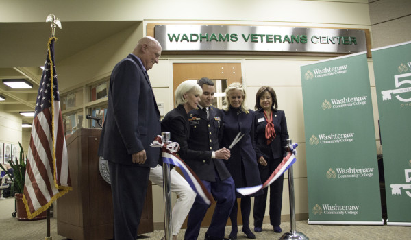 cutting of a ribbon as the veterans center is renamed in honor of the Wadhams