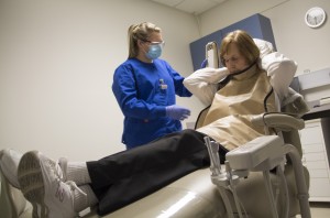 student preparing a patient for an x-ray