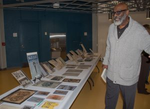 Thornton Perkins, WCC history professor, looks at artifacts from times of segregation.
