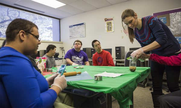 Kristina Jackson, special education teacher for the Young Adult Program helps the WISD students makes breakfast to start off their day. 