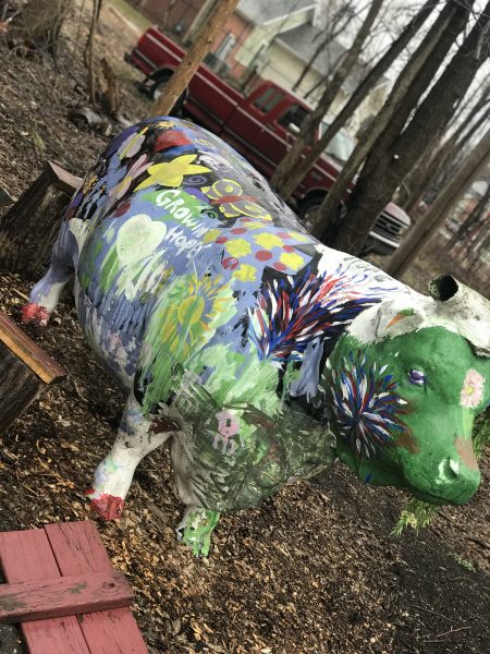 A painted cow statue at the Farmers Market located in Depot Town, Ypsilanti.