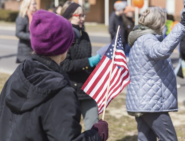An attendee waving an American flag during the “March For Our Lives” event.