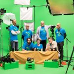 Students and staff stand in front of a green screen in a digital video suite where they offer a look at “movie magic” during Free College Day Sept. 30. Photo by Jennifer F. Sansbury