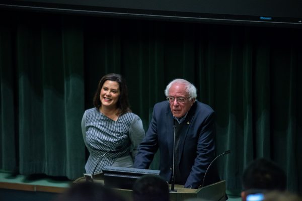 Democratic gubernatorial candidate Gretchen Whitmer stands with U.S. Sen. Bernie Sanders listening to questions from a crowd at Rackham Auditorium on the University of Michigan campus Friday, Oct. 19. Michael Govaere | Washtenaw Voice