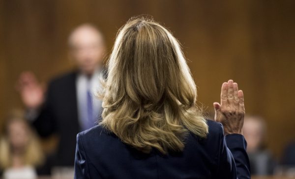 Christine Blasey Ford being sworn in before the Senate Judiciary Committee. Tribune Media