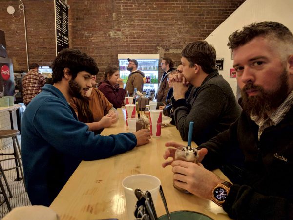Pete Leshkevich, front, takes out the team for dinner at Royals Hot Chicken. Vardan Sargsyan | Washtenaw Voice