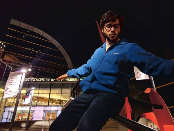 Staff Writer, Danny Villalobos, posing by a statue. Vardan Sargsyan | Washtenaw Voice