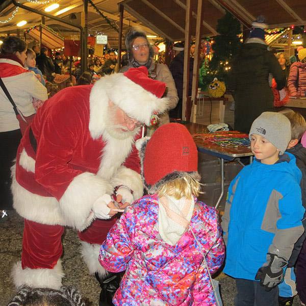 Children get in the holiday spirit with a visit from Santa at the Kerrytown Markets and Shops. Courtesy of Kerrytown Market and Shops