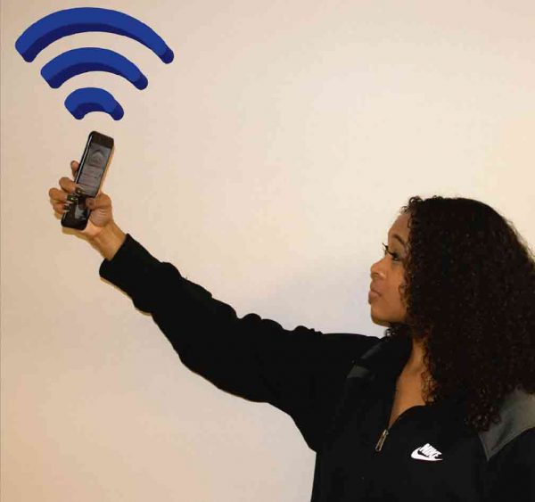 Bria Williams, WCC student, searches for WiFi on campus. Josh Mehay | Washtenaw Voice