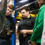 Graham Petersen (left), WTMC student, 16 and Matthew Bohl, lab assistant, show Gov. Whitmer the proccess of car brake installation. Sara Faraj | Washtenaw Voice