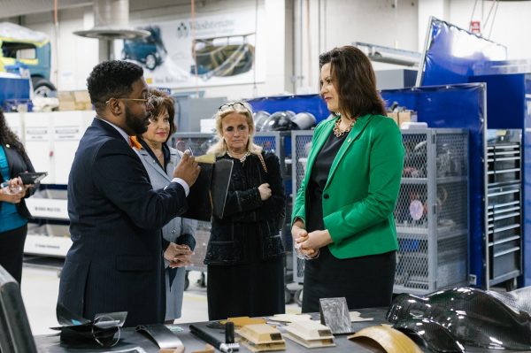 Brandon Tucker (left), dean of advanced technology and public service careers, discusses WCC advanced transportation materials with U.S. Rep Debbie Dingell, WCC President Rose Bellanca and Gov. Gretchen Whitmer. Sara Faraj | Washtenaw Voice