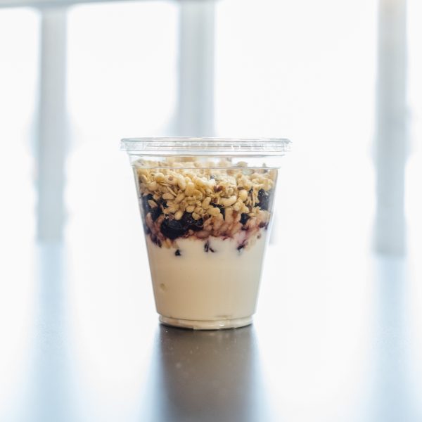 Yogurt parfait bar draws excitement from student Zac Barnes. Sara Faraj | Washtenaw Voice