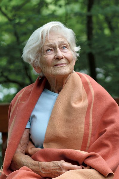 Irene Hasenberg Butter in 2013 with her childhood blanket, the same one she had in Westerbork, Bergen-Belsen, and Camp Jeanne d’Arc in Algeria. Courtesy of Irene Hasenberg Butter