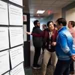 Meghan Rose, one of the librarians that assisted students in finding a story to listen to at The Human Library, speaking with a student. Lily Merritt | Washtenaw Voice