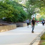 Students travel leisurely to class in 80 degree weather outside of The Technical & Industrial Building. Danny Villalobos | Washtenaw Voice