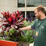 Steven Hoekstra, a Facility Management Worker, drives a water truck around campus to keep the flowers healthy and beautiful. Danny Villalobos | Washtenaw Voice