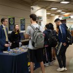 Representatives from The University of Michigan and Kettering University share with students the programs they have to offer. Eric Le | Washtenaw Voice
