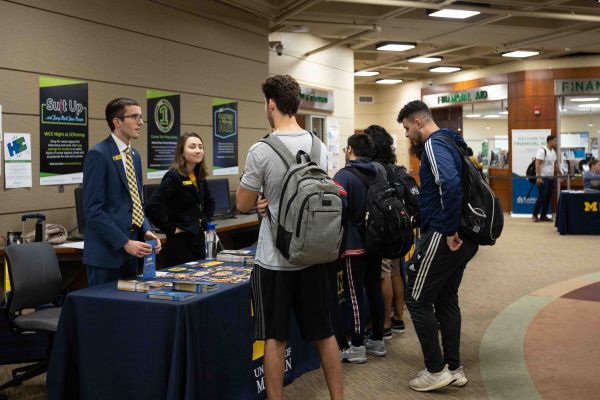 Representatives from The University of Michigan and Kettering University share with students the programs they have to offer. Eric Le | Washtenaw Voice