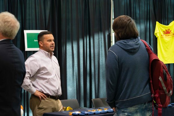 Kevin Ronquillo, a professional recruiter at Aerotek in Detroit, shares the advantage of using LinkedIn. Eric Le | Washtenaw Voice