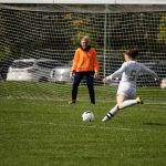 Hailey Donnellon shoots for a goal in a recent game against Mott Community College. Eric Le | Washtenaw Voice