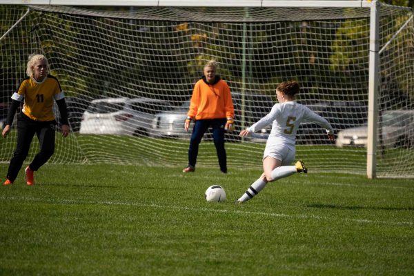 Hailey Donnellon shoots for a goal in a recent game against Mott Community College. Eric Le | Washtenaw Voice