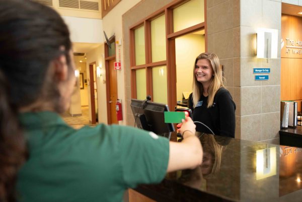 Olivia Colemen checks guests in before they enter WCC Fitness Center. Lily Merritt | Washtenaw Voice