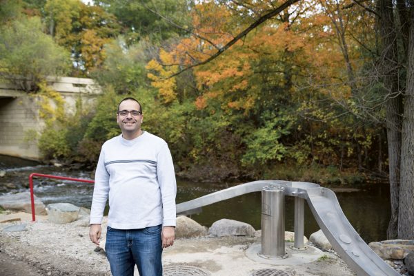 Aaron Cruz, a local Ann Arborite, stops at Parker Mill County Park often on lunch breaks to take photos of the leaves at the peak of their fall colors. Lily Merritt | Washtenaw Voice