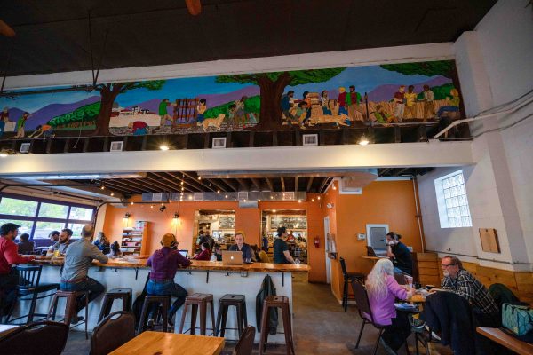 Cultivate Coffee and Tap House: Large tables for team collaboration. Arlo Flynn | Washtenaw Voice