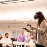 Brooke Hartman uses the augmented reality tool to practice a mock speech in front of a virtual class. Lily Merritt | Washtenaw Voice