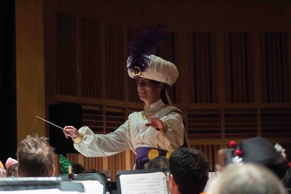 Conductor Christopher Heidenreich leads the Washtenaw County Concert Band at the “Art of Animated Characters” show. Varden Sargsyan | Washtenaw Voice