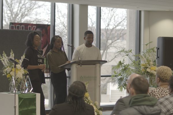 From left, Anaya Bass, Jenelle Smith and Joshua Harris, members of the WCC Black Student Union, perform a poem at the WCC Martin Luther King Jr, celebration. Eric Le | Washtenaw Voice