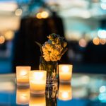 Decorative flowers illuminated by candlelight. Torrence Williams | Washtenaw Voice