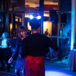 Colleen Villa (left) and Lajuanna Robbins enjoy the night's entertainment. Torrence Williams | Washtenaw Voice