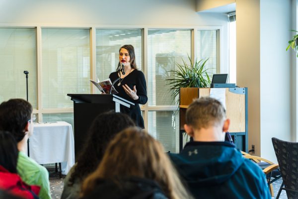 Isabelle T. reciting one of her original poems at the Lovesick release and open mic event. Torrence Williams | Washtenaw Voice