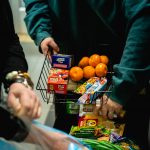 Preparing a basket for the snack pantry. Torrence Williams | Washtenaw Voice