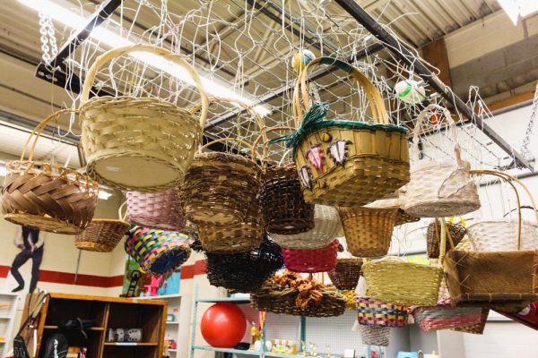 Woven baskets hang on display in the Ann Arbor PTO Thriftshop. Melissa Workman | Washtenaw Voice