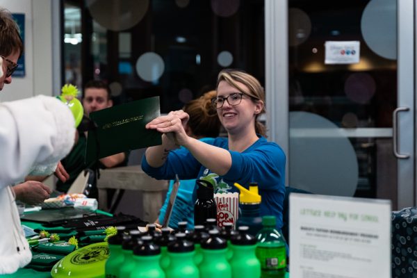 WCC students interact with staff and volunteers at tables in the Student Center during the Welcome Day event.