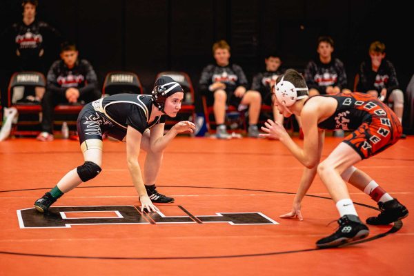 Lindsay Timbs, left, sqaures off against male opponents for the majority of her wrestling matches. Torrence Williams | Washtenaw Voice