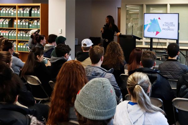 Aisha Bowe, WCC alumna and aerospace engineer, speaks at the Bailey Library for STEAM week. Torrence Williams | Washtenaw Voice